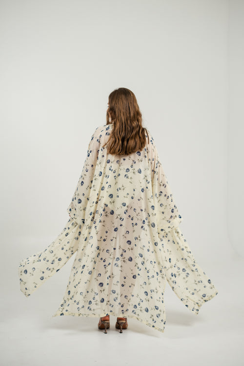 Біле напівпрозоре з блакитним квітковим принтом